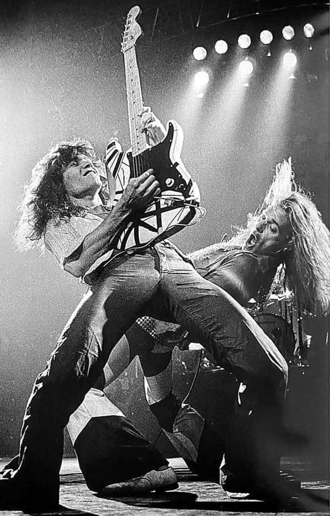 Van Halen live on stage — Eddie Van Halen on the Frankenstrat with David Lee Roth, black and white concert photo.